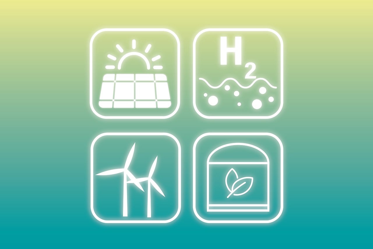 Symbole der Energiewende wie Solar, Windkraft, Biomasse